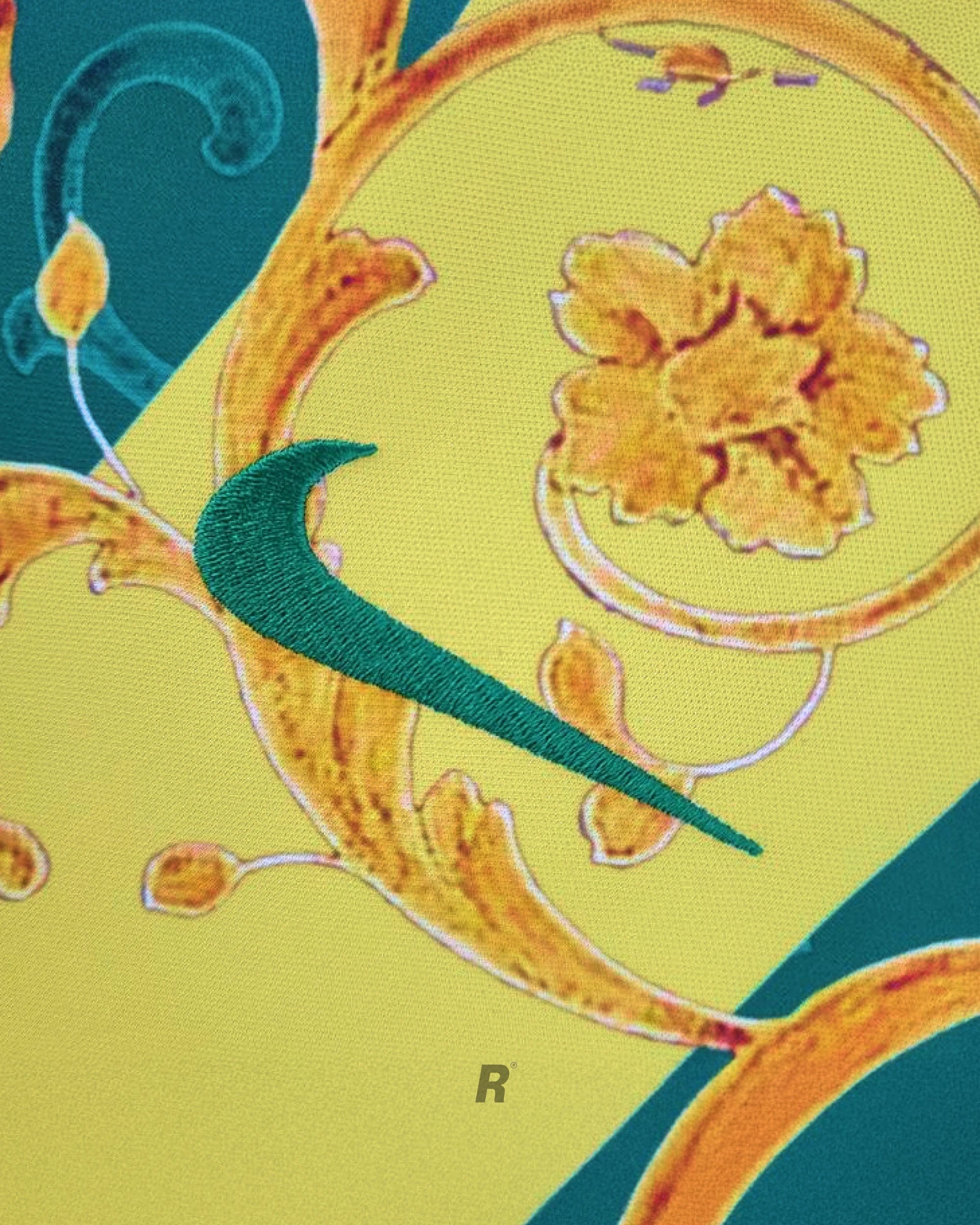 Close-up of Brazil Flowers Jersey jersey featuring vibrant floral design and Nike logo embroidered.