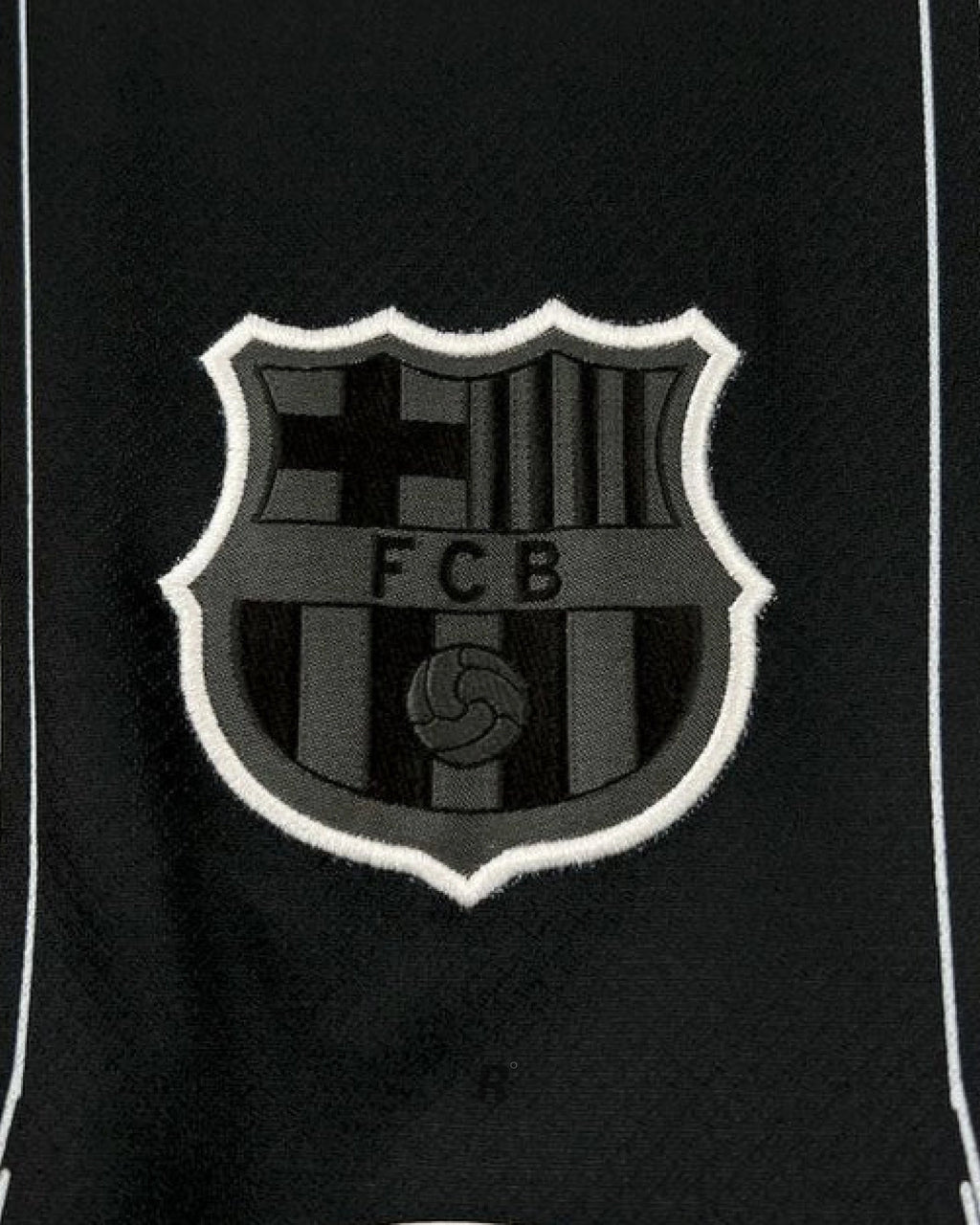 Side view emphasizing the modern cut and subtle accents of the Barcelona Black Special Edition Jersey, ideal for fans and collectors.