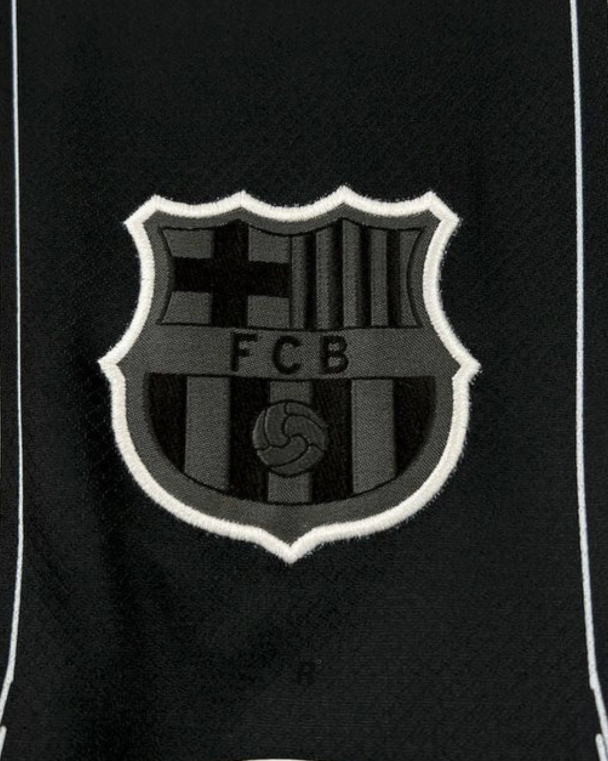 Side view emphasizing the modern cut and subtle accents of the Barcelona Black Special Edition Jersey, ideal for fans and collectors.