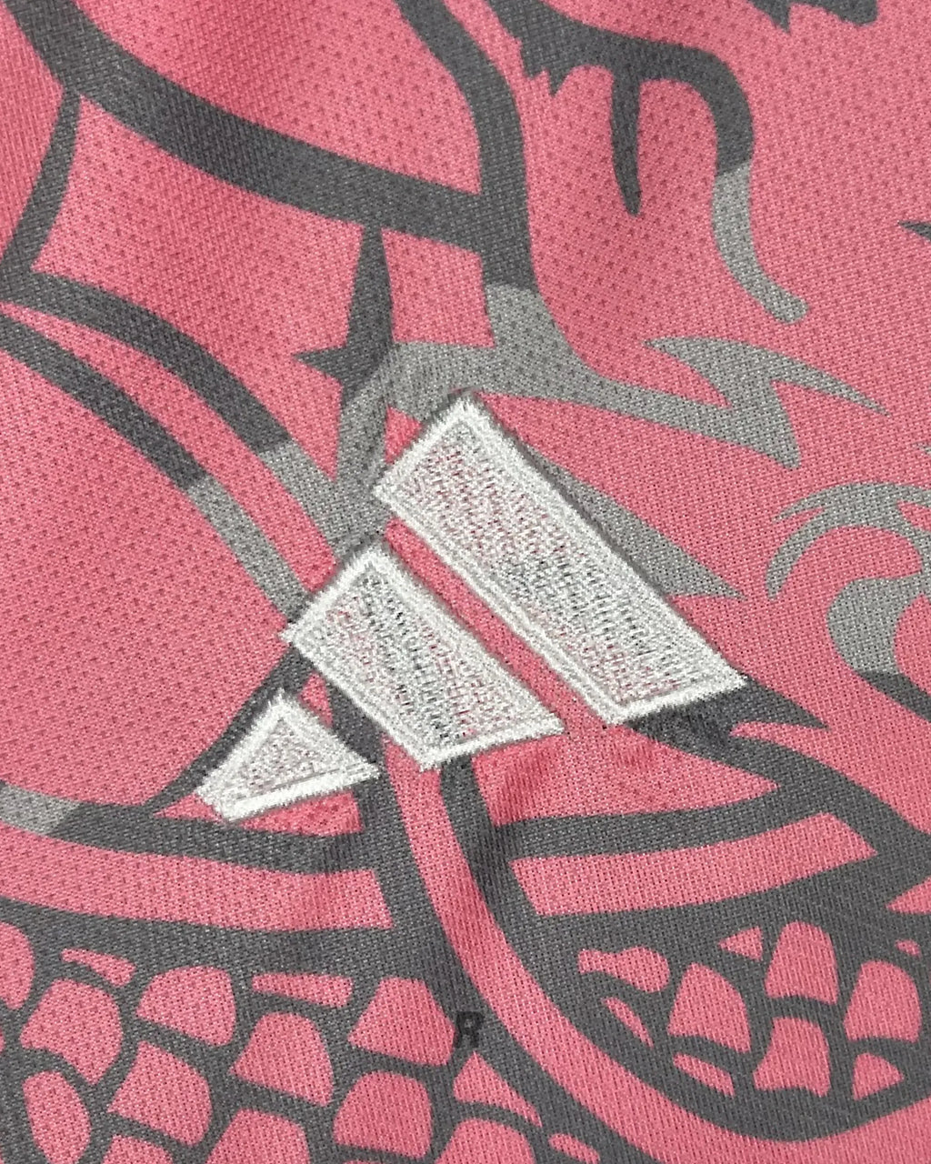 Focus on the striking pink dragon motifs of the Real Madrid Pink Dragons Jersey, celebrating Ronaldo’s iconic era. High-quality, detailed, and built to impress.