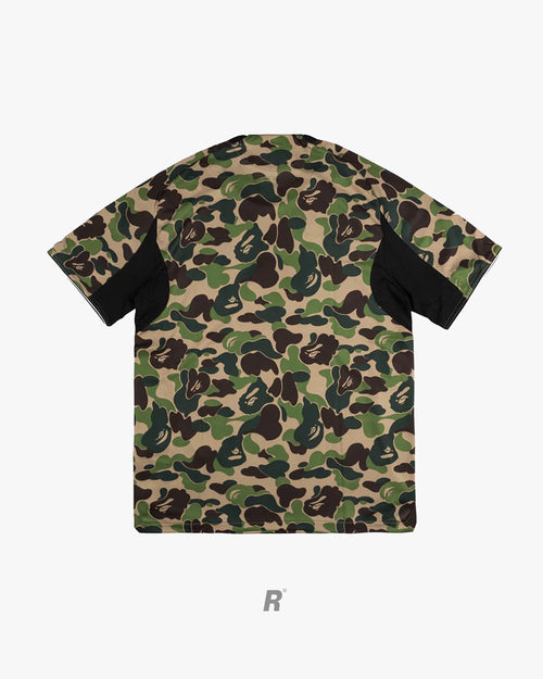 Green camo perfection. The Bape Green Football Jersey delivers street luxury on and off the pitch.